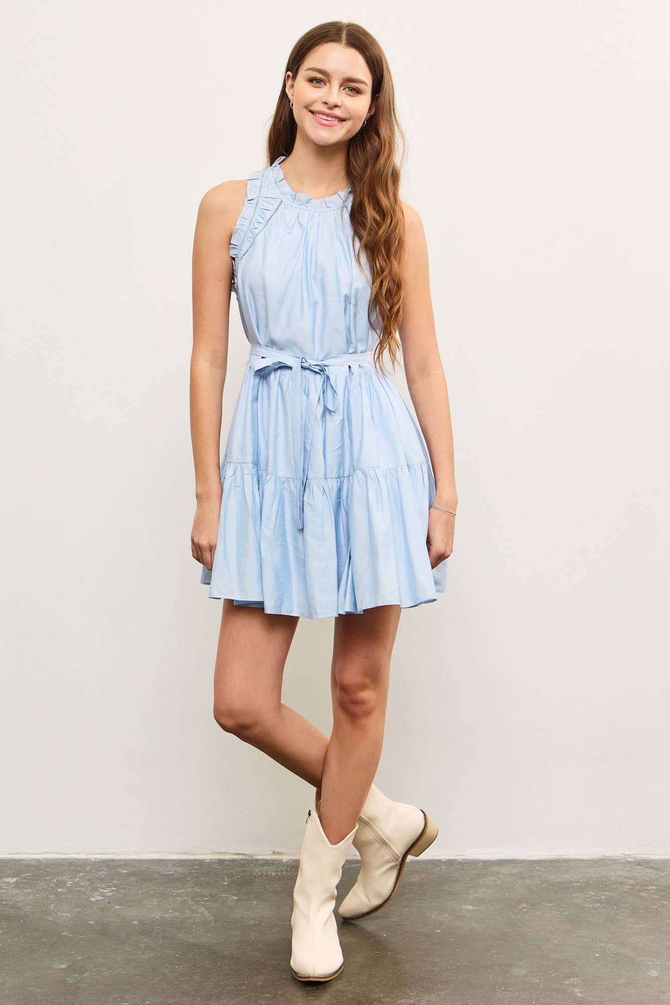 Light blue sleeveless mini dress with ruffle trim and shirred waist – soft and breezy summer style