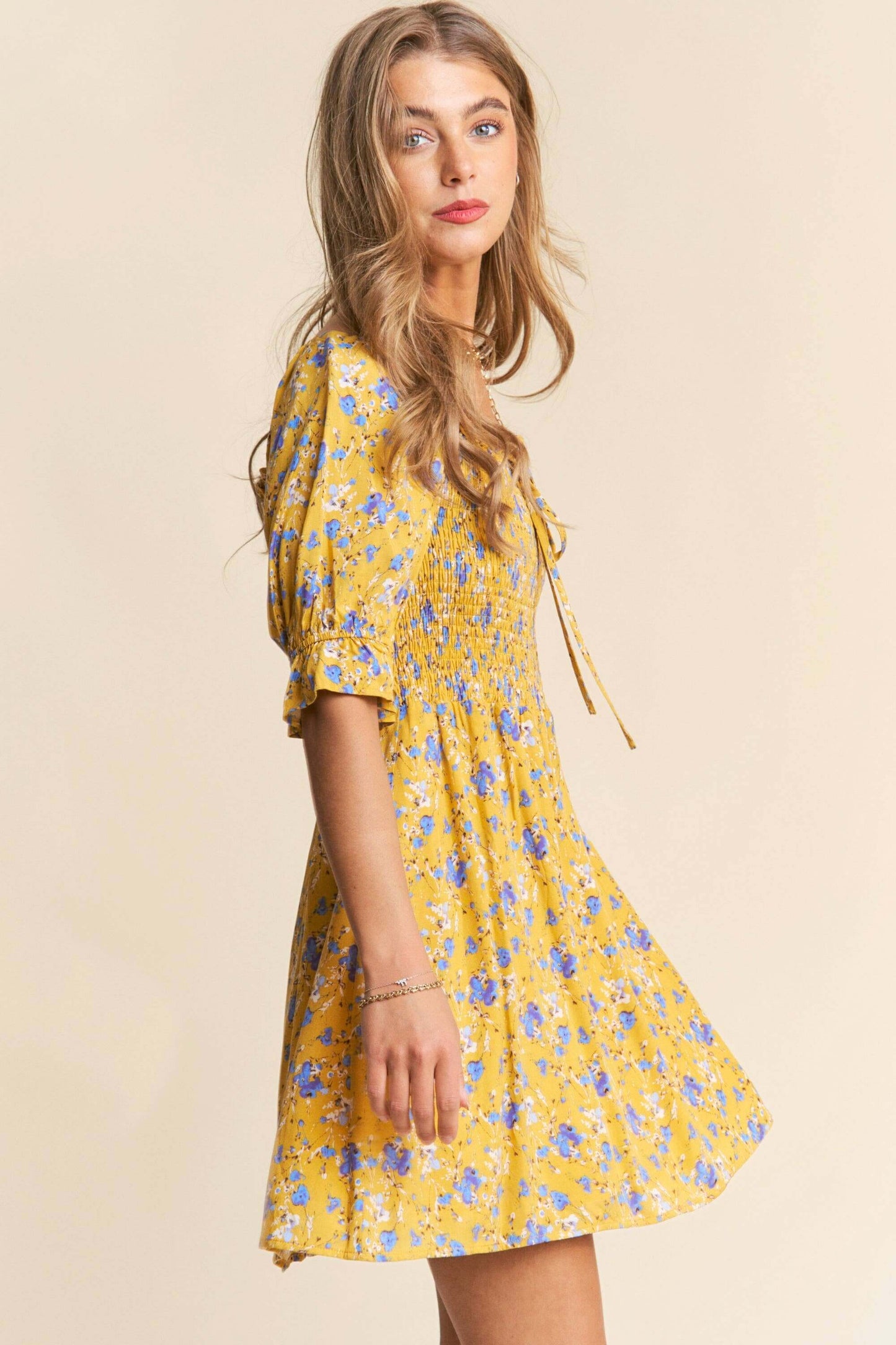 Yellow and white floral print babydoll dress with smocked bust and puff sleeves – flirty and feminine mini dress