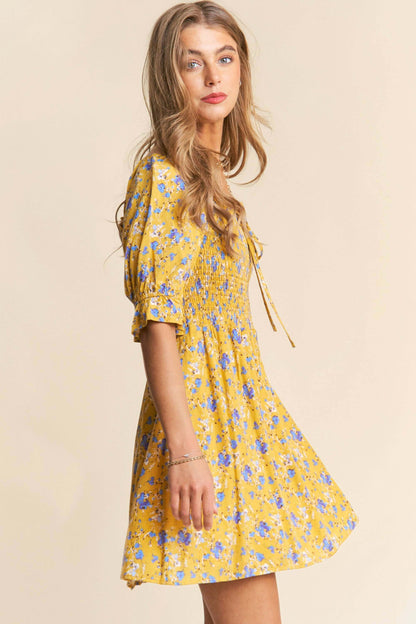 Yellow and white floral print babydoll dress with smocked bust and puff sleeves – flirty and feminine mini dress