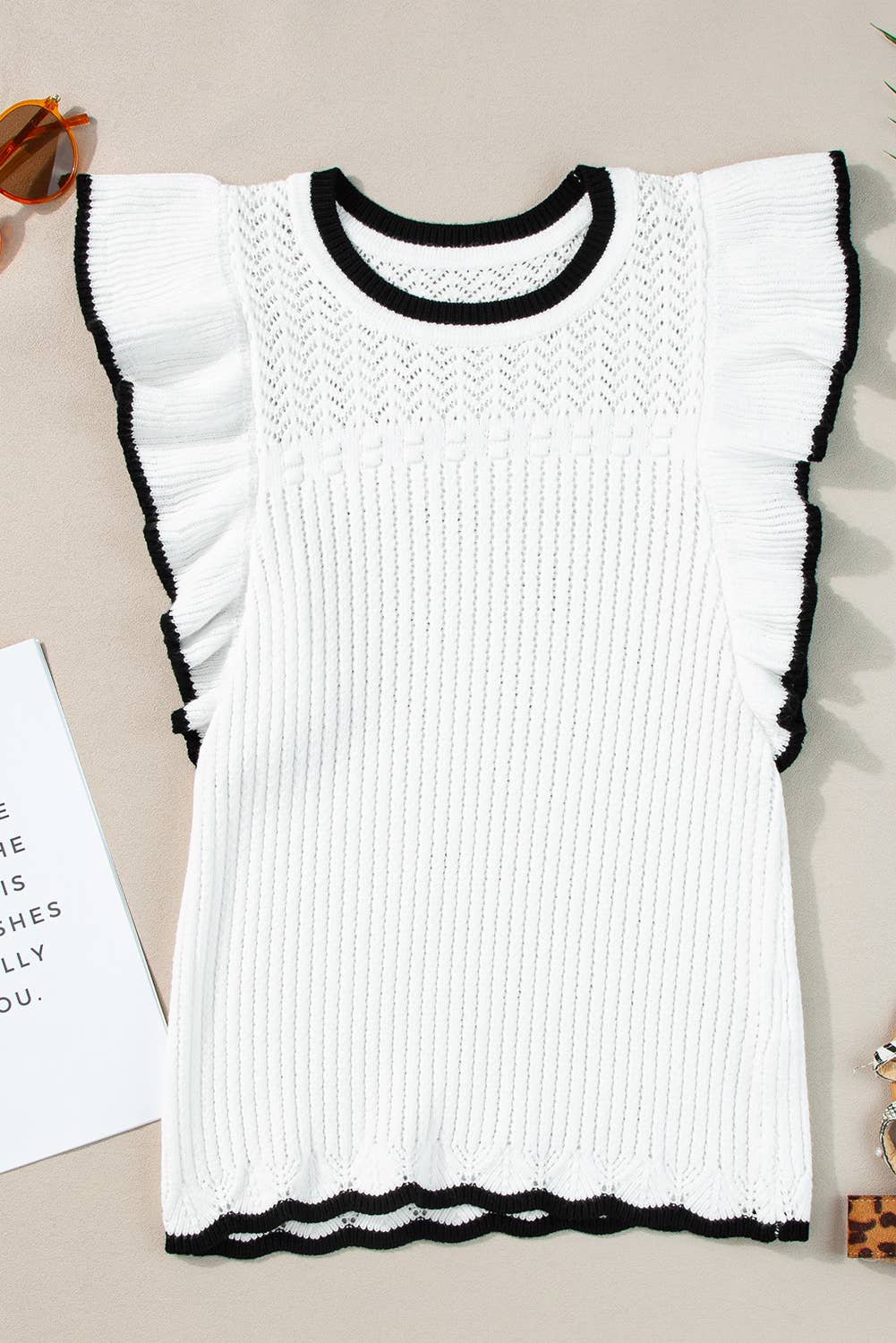 White crochet knit tank with delicate eyelet pattern and black-trimmed flutter sleeves – lightweight boho top