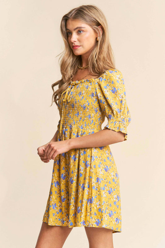 Yellow and white floral print babydoll dress with smocked bust and puff sleeves – flirty and feminine mini dress