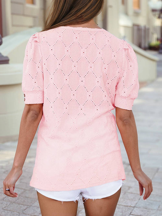 Blush pink eyelet floral short sleeve top with geometric texture and buttons – casual summer blouse.