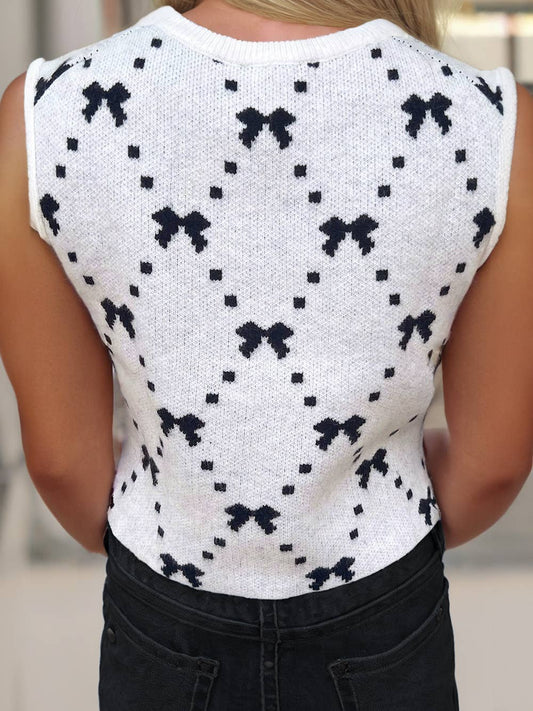 Ivory knit cropped sweater vest with bow pattern and side button details – sleeveless trendy layering top