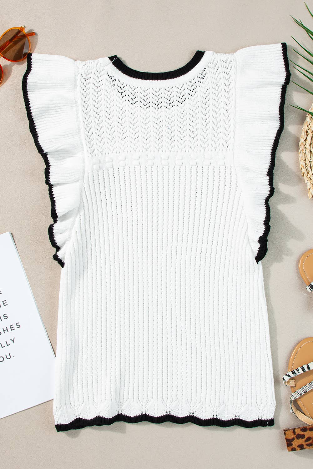 White crochet knit tank with delicate eyelet pattern and black-trimmed flutter sleeves – lightweight boho top