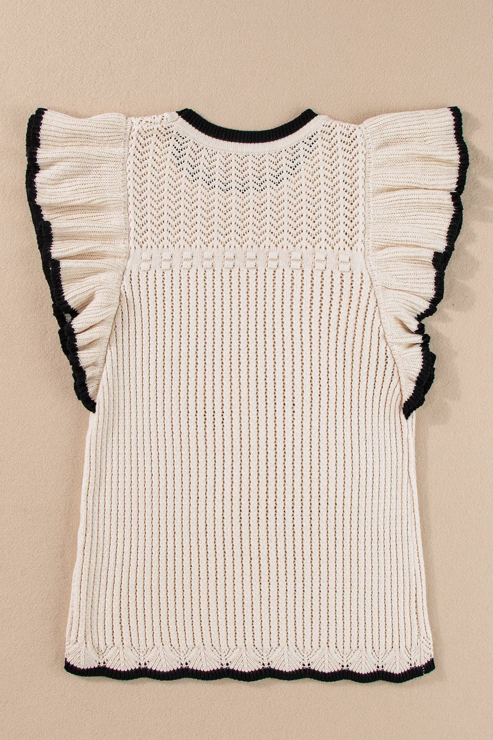 White crochet knit tank with delicate eyelet pattern and black-trimmed flutter sleeves – lightweight boho top