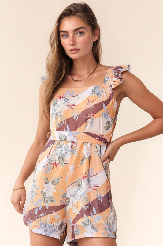 Yellow and mauve floral print romper with square neckline and ruffle shoulder detail – lightweight and playful one-piece outfit